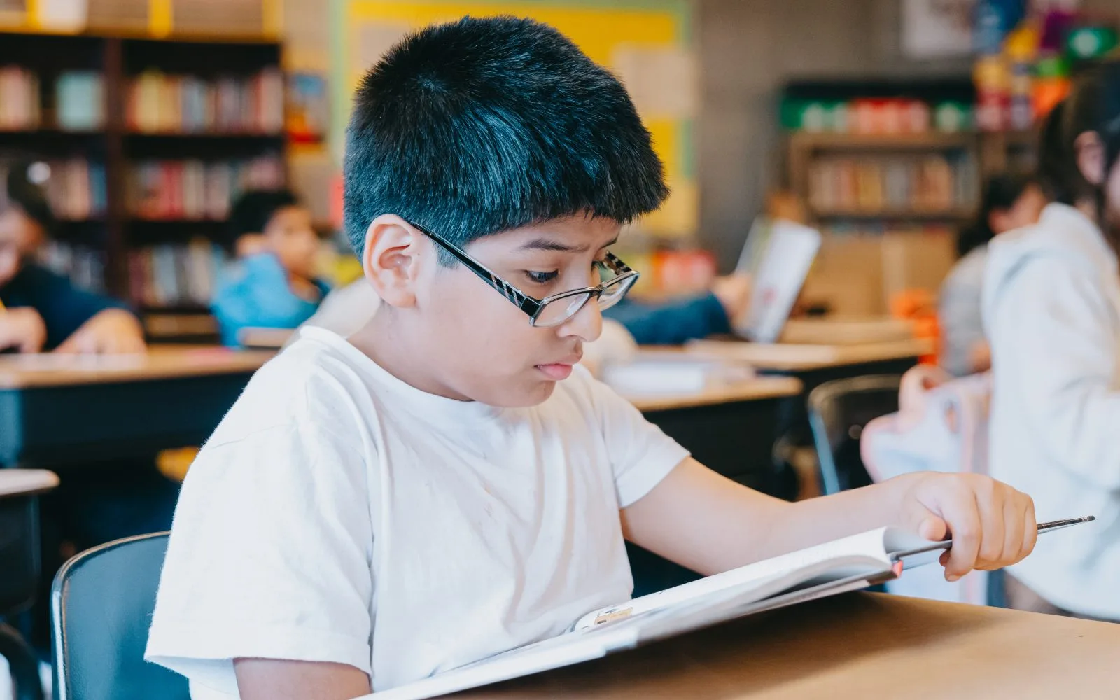 Greeley-boy in white reading